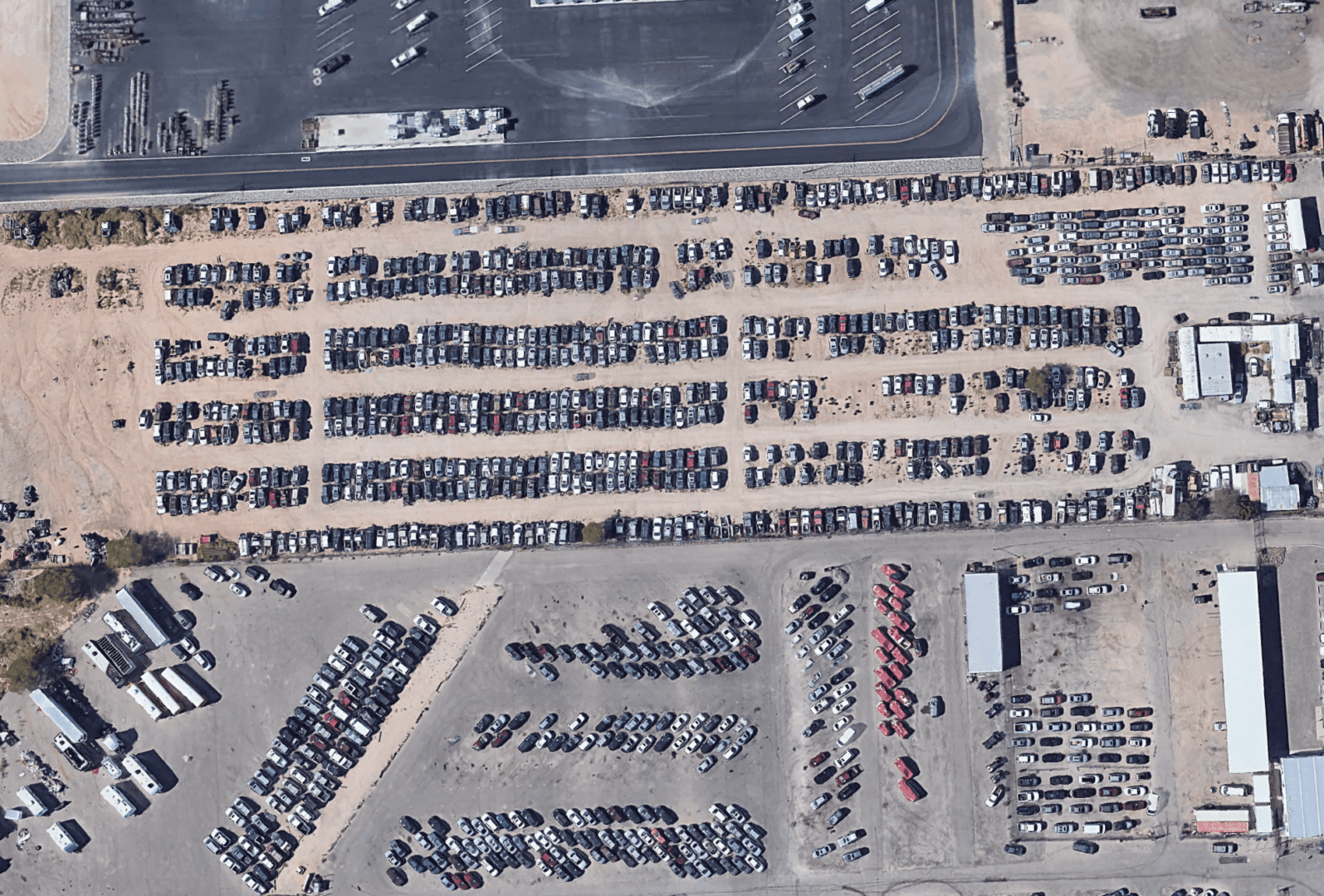 A lot of cars parked in the middle of nowhere.