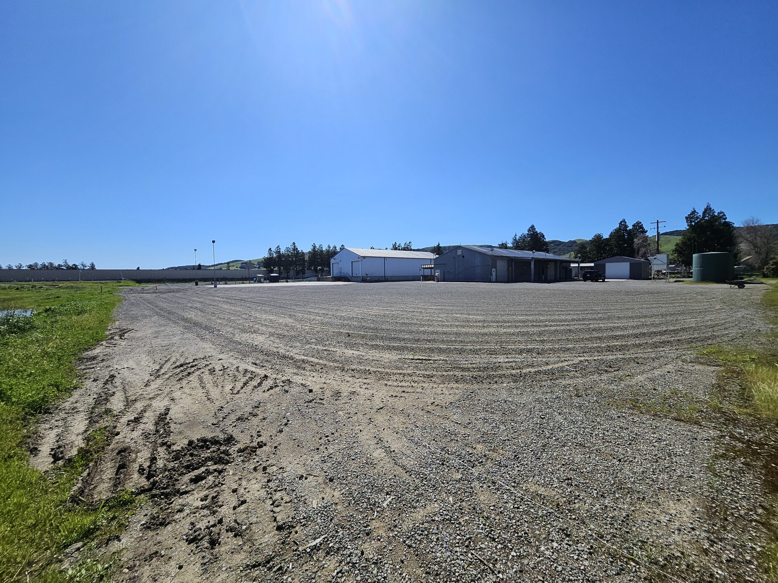 A field with no grass and lots of dirt.